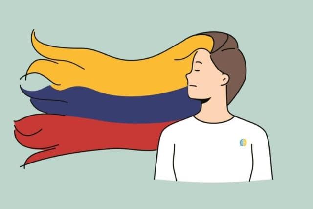 A woman with hair with the colors of the Colombian flag